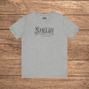 Heather Gray Bella+Canvas 3001 t-shirt featuring a vintage Shelby Company Limited logo from Peaky Blinders.