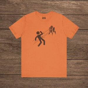 Orange Aperture Science Turret warning icon t-shirt on Bella+Canvas 3001, vintage distressed print, Portal and Portal 2 fan tee.