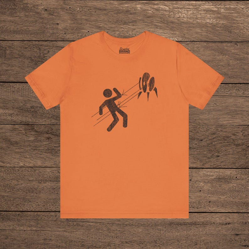 Orange Aperture Science Turret warning icon t-shirt on Bella+Canvas 3001, vintage distressed print, Portal and Portal 2 fan tee.