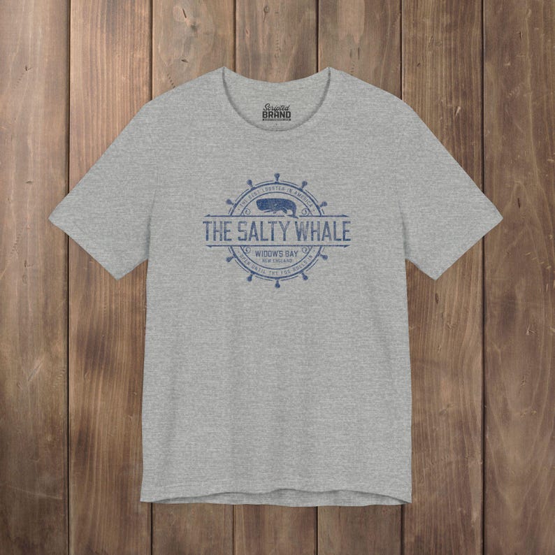 Heather gray The Salty Whale vintage distressed pub logo t-shirt inspired by Widow's Bay Apple TV series, soft Bella+Canvas cotton tee