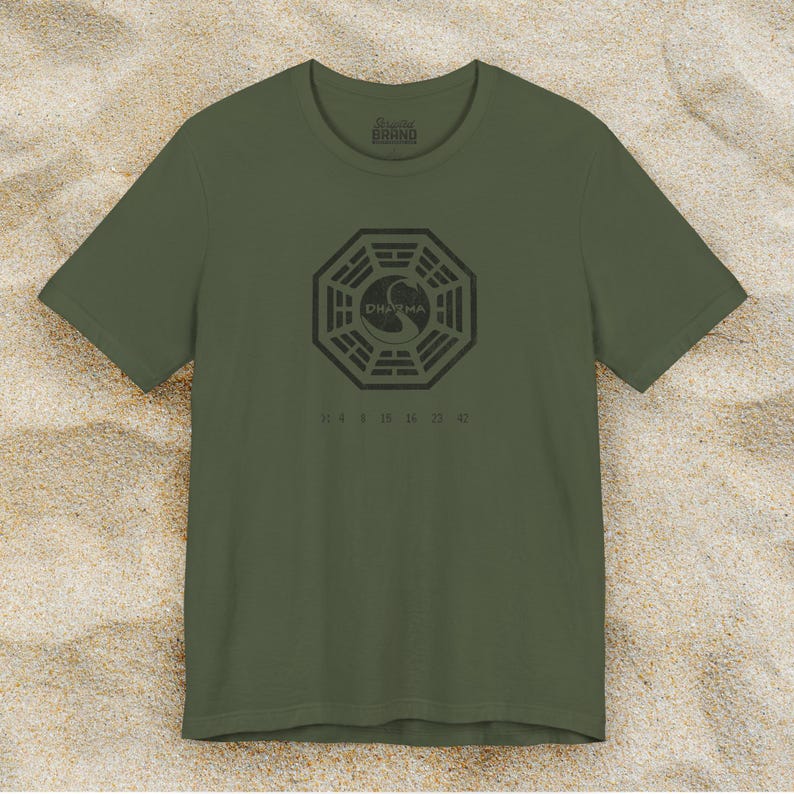 Military Green short-sleeve t-shirt featuring the Dharma Initiative swan logo graphic from the TV show LOST in a vintage distressed style.