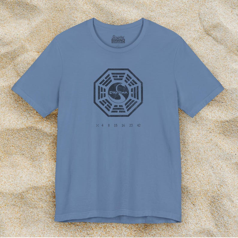 Lavender Blue short-sleeve t-shirt featuring the Dharma Initiative swan logo graphic from the TV show LOST in a vintage distressed style.