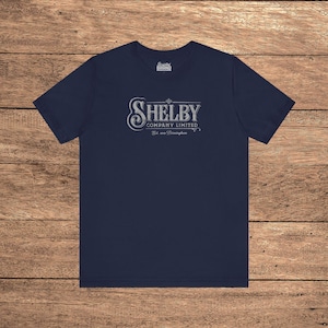 Navy Blue Bella+Canvas 3001 t-shirt featuring a vintage Shelby Company Limited logo from Peaky Blinders.