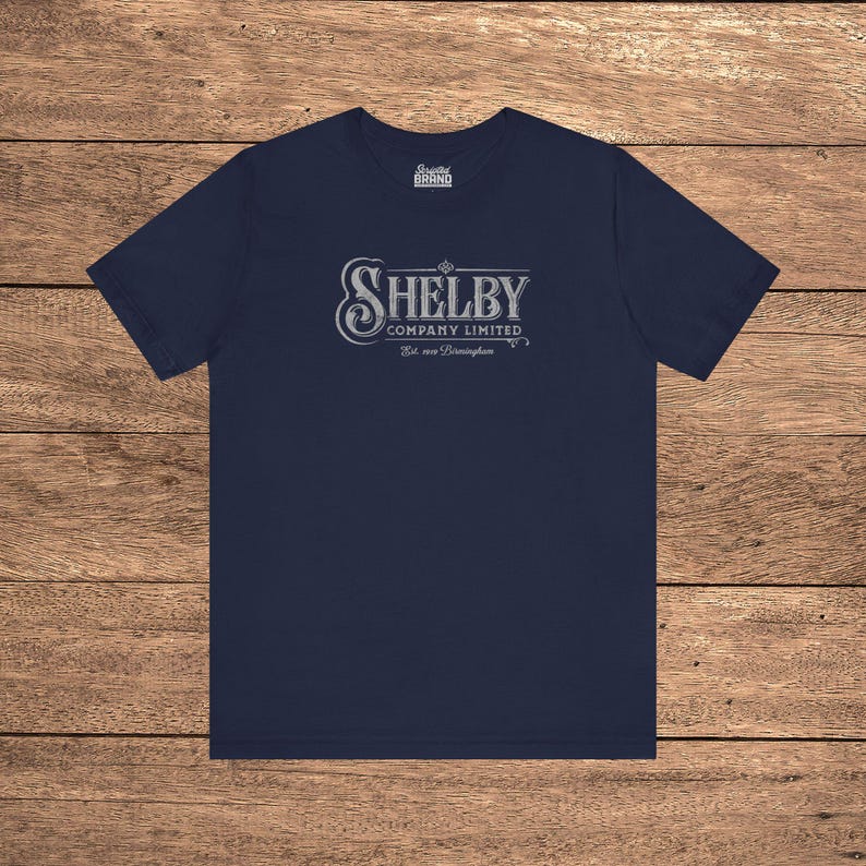 Navy Blue Bella+Canvas 3001 t-shirt featuring a vintage Shelby Company Limited logo from Peaky Blinders.