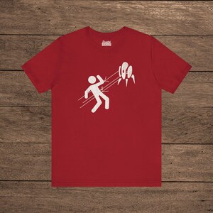 Red Aperture Science Turret warning icon t-shirt on Bella+Canvas 3001, vintage distressed print, Portal and Portal 2 fan tee.