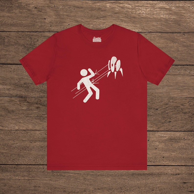 Red Aperture Science Turret warning icon t-shirt on Bella+Canvas 3001, vintage distressed print, Portal and Portal 2 fan tee.
