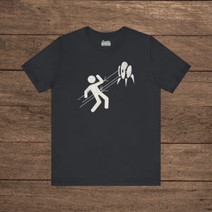 Black Aperture Science Turret warning icon t-shirt on Bella+Canvas 3001, vintage distressed print, Portal and Portal 2 fan tee.