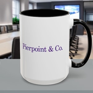 May include: White ceramic coffee mug with a black rim and handle. The mug has the text "Pierpoint & Co." printed in purple on the front.