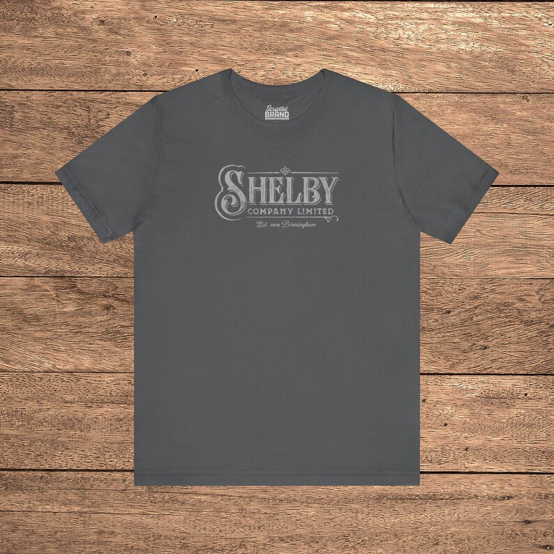 Asphalt Grey Bella+Canvas 3001 t-shirt featuring a vintage Shelby Company Limited logo from Peaky Blinders.
