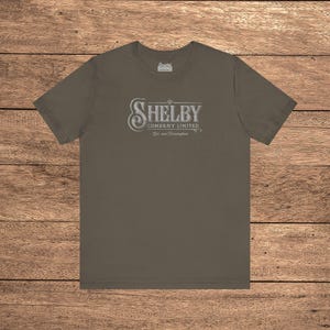 Army green Bella+Canvas 3001 t-shirt featuring a vintage Shelby Company Limited logo from Peaky Blinders.