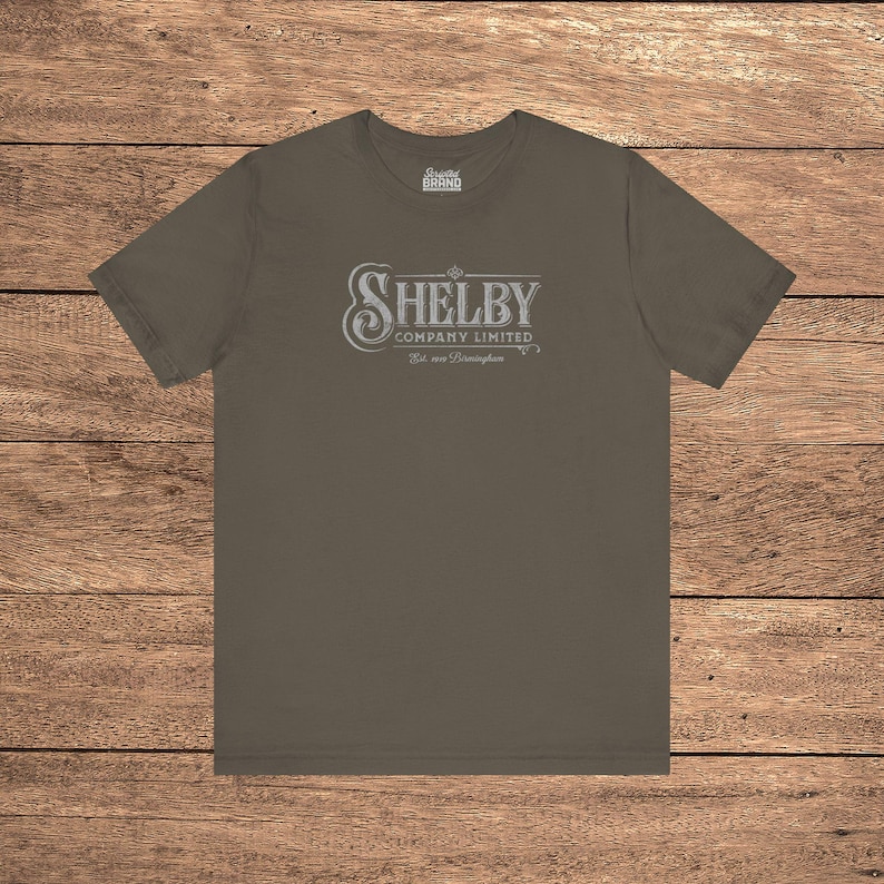 Army green Bella+Canvas 3001 t-shirt featuring a vintage Shelby Company Limited logo from Peaky Blinders.