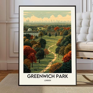 May include: A framed art print of Greenwich Park in London. The artwork depicts a park scene with trees in autumn colors, a winding path, and buildings in the distance. The text "GREENWICH PARK LONDON" is at the bottom.