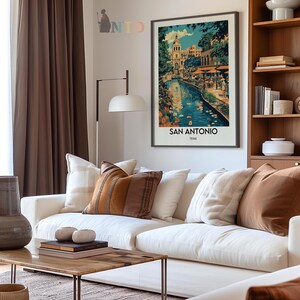 May include: A vintage travel poster featuring a colorful illustration of a riverfront scene in San Antonio, Texas. The poster has a blue, green, and brown color scheme and features a building with a white dome.
