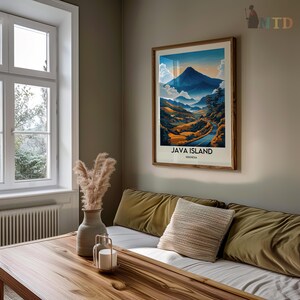 May include: A framed poster with a colorful illustration of a mountain range and a winding road. The poster is titled "Java Island, Indonesia".