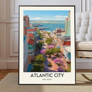 May include: A framed art print depicting Atlantic City, New Jersey, with a colourful street scene, buildings, trees, and a view of the sea. The print is in a black frame and has the text "ATLANTIC CITY" and "NEW JERSEY".