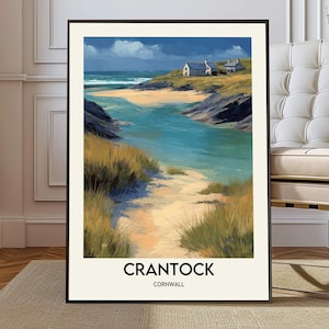May include: A framed art print featuring a coastal landscape with a sandy beach, turquoise water, and a small white building. The artwork has a painterly style with visible brushstrokes. The text "CRANTOCK CORNWALL" is printed at the bottom of the print.