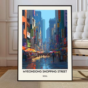 May include: A framed art print of Myeongdong Shopping Street in Seoul. The image depicts a bustling street scene with colorful buildings, awnings, and pedestrians. The text "Myeongdong Shopping Street Seoul" is printed at the bottom.