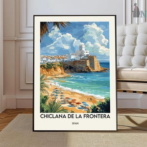 May include: A framed art print of Chiclana de la Frontera, Spain, featuring a coastal scene with a beach, ocean, and buildings. The artwork has a vintage travel poster style with vibrant colors and a black frame.