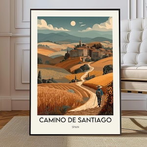 Könnte beinhalten: Gerahmter Kunstdruck mit einer Landschaftsszene des Camino de Santiago in Spanien. Das Kunstwerk zeigt einen Wanderweg, eine Person mit Wanderstab und ein Dorf. Die Farbpalette umfasst Orange-, Gelb- und Blautöne. Der Text "CAMINO DE SANTIAGO SPAIN".