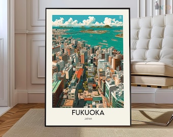 May include: A framed art print featuring an aerial view of Fukuoka, Japan. The artwork depicts a cityscape with buildings of various heights and colors, a body of water, and a bright blue sky with fluffy white clouds. The text "FUKUOKA JAPAN" is at the bottom.