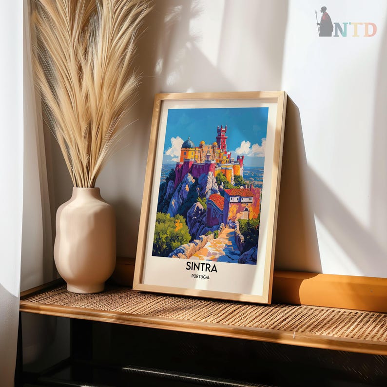 May include: A framed print of a colorful illustration of a castle on a hill with the text "SINTRA PORTUGAL" at the bottom.