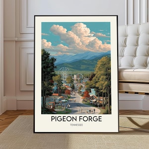 May include: A framed art print of Pigeon Forge, Tennessee, featuring a scenic view of the town with a Ferris wheel, shops, and mountains under a cloudy sky. The print has the text "Pigeon Forge Tennessee" at the bottom.