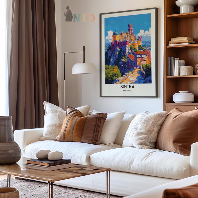 May include: A vintage travel poster featuring a colorful illustration of a castle on a hilltop in Sintra, Portugal. The poster has a blue sky with white clouds and a green hillside with a winding path leading up to the castle. The text "SINTRA PORTUGAL" is printed at the bottom of the poster.