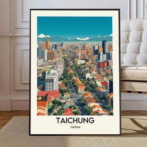 May include: A framed art print featuring a stylized illustration of Taichung, Taiwan. The artwork depicts a cityscape with buildings, trees, and mountains under a blue sky. The city's name is printed in bold, black letters at the bottom.