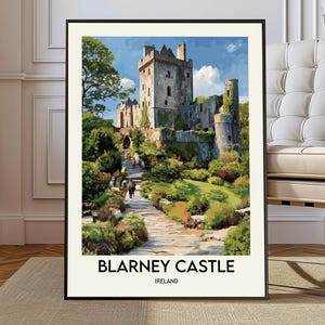 May include: A framed print of Blarney Castle in Ireland. The artwork depicts the castle with a stone pathway leading to the entrance, surrounded by lush greenery. The sky is blue with fluffy white clouds. The text "BLARNEY CASTLE IRELAND" is at the bottom.