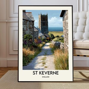 Pode incluir: Impressão emoldurada de uma pitoresca cena de vila inglesa. Um caminho de pedra leva a edifícios e uma torre de igreja, com o texto "ST KEVERNE ENGLAND" na parte inferior. A obra de arte está em uma moldura preta.