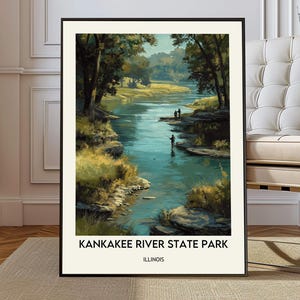 May include: Framed art print of Kankakee River State Park in Illinois. The artwork depicts a serene river scene with trees, grassy banks, and figures fishing. The print has a black frame and a cream-colored border, with the park's name and state printed at the bottom.