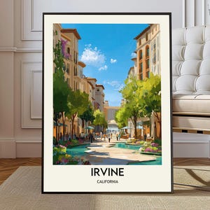 May include: A framed art print featuring a vibrant street scene in Irvine, California. The artwork depicts buildings, trees, and a water feature under a bright blue sky. The word "IRVINE" and "CALIFORNIA" are printed at the bottom of the image.