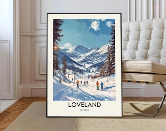May include: A framed art print featuring a winter landscape of Loveland Ski Area. The artwork depicts skiers on a snowy slope with mountains in the background under a blue sky. The print has the words "LOVELAND SKI AREA" at the bottom.