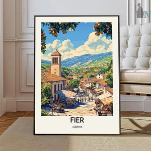 May include: A framed art print depicting a vibrant street scene in Fier, Albania. The artwork showcases a bustling marketplace with buildings, a church tower, and lush green hills under a bright blue sky. The word "FIER" and "ALBANIA" are printed at the bottom.