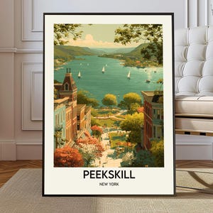 May include: A framed art print depicting Peekskill, New York, showcasing a river scene with sailboats, buildings, and greenery. The print has a vintage style, a black frame, and the text "PEEKSKILL NEW YORK" at the bottom.
