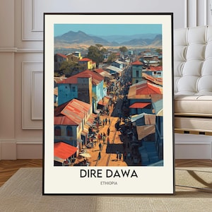 May include: A framed print of Dire Dawa, Ethiopia, depicting a bustling street scene with colorful buildings and people. The artwork features a vibrant palette of blues, reds, and yellows, with a mountain range in the background. The text "DIRE DAWA ETHIOPIA" is at the bottom.