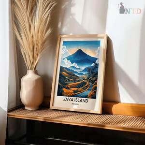 May include: A framed print of a mountain landscape with a winding road leading to the peak. The print is titled "Java Island, Indonesia".