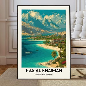 May include: A framed art print of Ras Al Khaimah, United Arab Emirates. The artwork depicts a coastal landscape with turquoise water, a sandy beach, palm trees, and mountains in the background. The print has a black frame and the text "RAS AL KHAIMAH" and "UNITED ARAB EMIRATES" at the bottom.