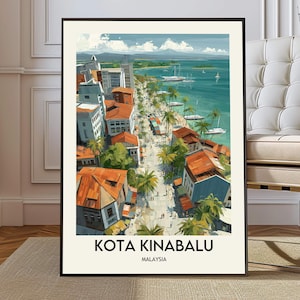 May include: A framed art print of Kota Kinabalu, Malaysia. The artwork depicts a coastal city with buildings, palm trees, and boats on the turquoise water. The text "KOTA KINABALU MALAYSIA" is at the bottom of the print.