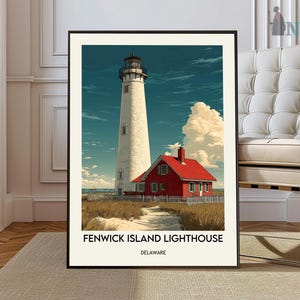 May include: A framed print featuring the Fenwick Island Lighthouse in Delaware. The artwork depicts a tall white lighthouse next to a red building under a blue sky with clouds. The text "FENWICK ISLAND LIGHTHOUSE DELAWARE" is at the bottom.