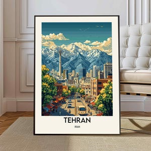 May include: A framed art print of Tehran, Iran, featuring a cityscape with a prominent tower and snow-capped mountains in the background. The artwork has a vintage travel poster style with a blue sky and green trees.