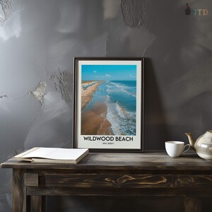 May include: A framed print depicting Wildwood Beach, New Jersey. The image shows a beach with blue ocean waves, a sandy shore, and a bright blue sky. The text "Wildwood Beach, New Jersey" is printed at the bottom of the frame.