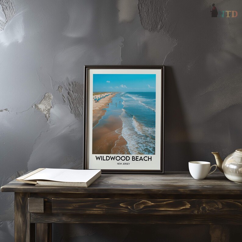 May include: A framed print depicting Wildwood Beach, New Jersey. The image shows a beach with blue ocean waves, a sandy shore, and a bright blue sky. The text "Wildwood Beach, New Jersey" is printed at the bottom of the frame.