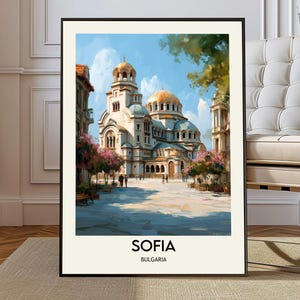 May include: Framed art print of the Alexander Nevsky Cathedral in Sofia, Bulgaria. The artwork depicts the cathedral with gold domes, surrounded by buildings and trees. The text "SOFIA BULGARIA" is at the bottom.