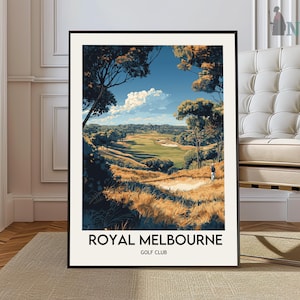 May include: A framed art print of a golf course landscape under a blue sky with clouds. The artwork shows a green golf course surrounded by trees and golden-brown grass. The text "ROYAL MELBOURNE GOLF CLUB" is printed at the bottom of the print.