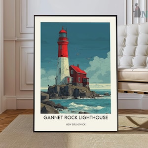 Pode incluir: Uma impressão emoldurada do Farol de Gannet Rock em New Brunswick. O farol é vermelho e branco, com um edifício de telhado vermelho anexado. A obra de arte é definida contra um céu azul e um oceano, com o texto "Gannet Rock Lighthouse" e "New Brunswick".