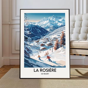 May include: Framed art print depicting a ski resort in a snowy mountain landscape. The image shows skiers, chalets, and snow-covered trees. The text "LA ROSIÈRE SKI RESORT" is at the bottom. The colour scheme includes blues, whites, and oranges.