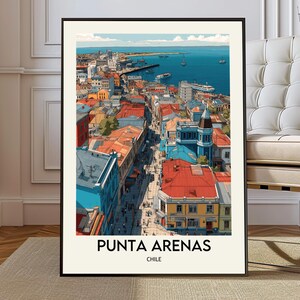 May include: A framed print of Punta Arenas, Chile, featuring a colorful cityscape with red, blue, and yellow buildings. The artwork depicts a coastal town with a harbor and boats on the blue sea. The text "PUNTA ARENAS" and "CHILE" are printed at the bottom.