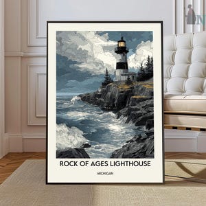 May include: A framed art print featuring the Rock of Ages Lighthouse in Michigan. The artwork depicts the lighthouse on a rocky cliffside with crashing waves and a cloudy sky. The lighthouse is black and white with a light at the top. The text "ROCK OF AGES LIGHTHOUSE MICHIGAN" is at the bottom.