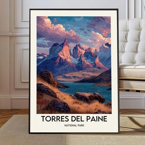May include: A framed art print showcasing the Torres del Paine National Park landscape. The image presents towering mountains, a tranquil lake, and a colourful sky with pink and blue tones. The text "TORRES DEL PAINE NATIONAL PARK" is at the bottom.